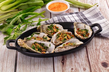 Gournet grilled oysters with onion and peanut