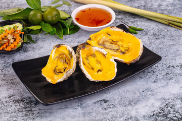 Baked oyster with cheddar cheese