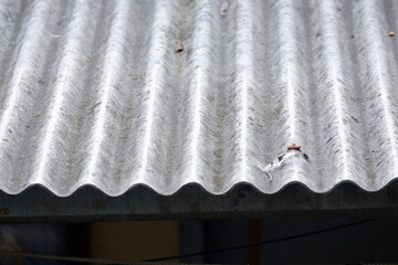 Detailed photo of asbestos roof of a house