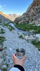 Obraz premium Kyrgyzstan, Ala Archa, Switzerland, Alps, waterfall in the mountains, beautiful sight, water stream flows in the grahs, mountain river beats on the rocks, fantastic nature