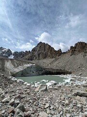 A glacier in the mountains. Kyrgyzstan, Ala Archa National Park. Uchitel glacier. Ice blocks lying...