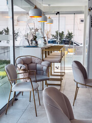 Stylish interior of a modern cafe with elegant furnishings and ample natural light