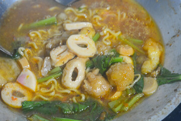 The process of cooking seblak uses traditional methods, namely with a stove and firewood in the rice fields