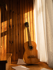 acoustic guitar on wooden background