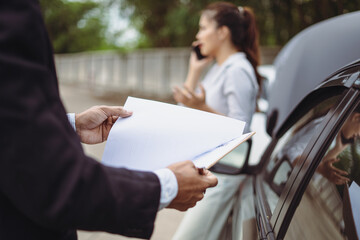 Asian woman customer and mechanic discussing car insurance. Female manager and car mechanic. Car repair and maintenance concept.