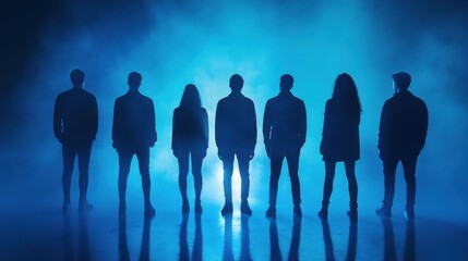 Eight people stand in silhouette against a blue light, creating a dramatic and mysterious image