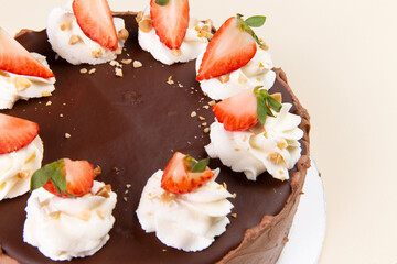 Chocolate cake with strawberries and cream.