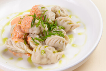 Traditional dumplings, Vareniki with sauce.