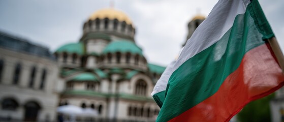 Bulgarian flag waving proudly in front of the Alexander Nevsky Cathedral in Sofia, Bulgaria Symbol of patriotism, national identity, and cultural heritage