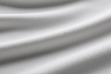 White fabric texture with soft waves and subtle light patterns