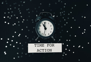 The words Time for Action are written below the clock