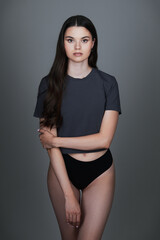 Obraz premium Studio fashion: lovely young girl in shirt and underpants. Model test