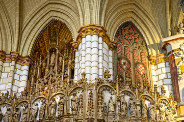 Interior architectural features with arches, columns, and religious saints inside the Catholic...