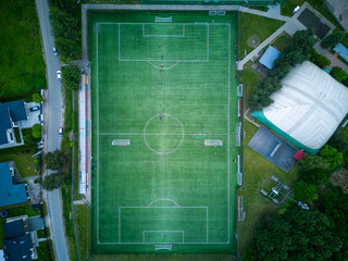 View from above of the all-season football pitch with players.