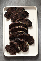 Top View Sliced Sourdough Brownie on White Enamel Tray.