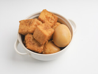 Tofu and egg stew in white bowl
