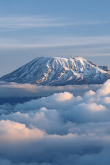 breathtaking view of mount kilimanjaro emerging from sea of clouds majestic peak and its snowcapped summit