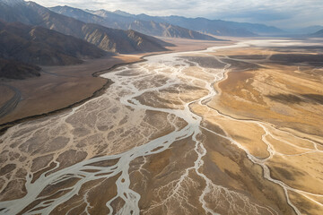 Aerial view of braided river in arid valley with intricate channels, erosion patterns, sediment transport, and geological formations under vast skies. generative ai