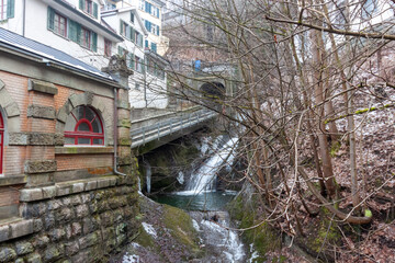 A wintery view of the Mühleggbahn funicular in St. Gallen, showcasing the intersection of urban...