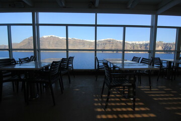 Ship restaurant - sailing by Santorini island
