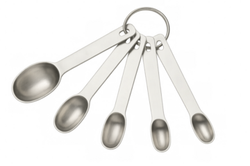 Set of metal measuring spoons hanging on ring with transparent background