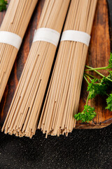 Buckwheat noodles raw soba fresh dish natural food Asian cuisine on the table rustic food top view copy space