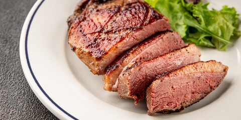 Duck breast roast meat poultry fresh delicious gourmet food background on the table rustic food top view copy space