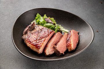 Duck breast roast meat poultry fresh delicious gourmet food background on the table rustic food top view copy space