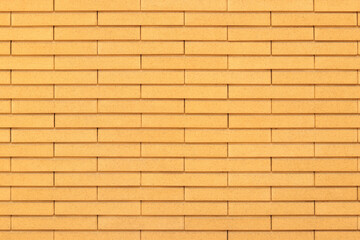 Fototapeta premium Facade cladding with artificial stone, ventilated facade. Background. Building. Architecture and construction. External wall of the building with artificial decorative stone. Material