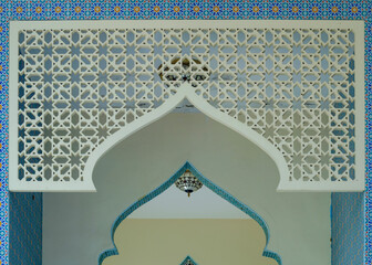 Central Islamic hallway with symmetrical arches and sacred atmosphere