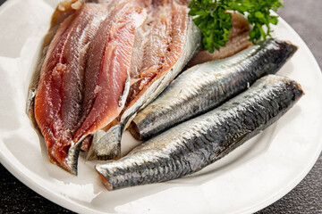 Sardine raw fish fillet seafood anchovy filet fresh delicious gourmet food background on the table rustic food top view copy space pescetarian diet