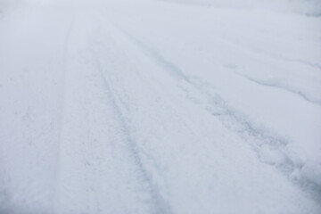 Fresh Snow-Covered Road Blanketed in Winter White Landscape