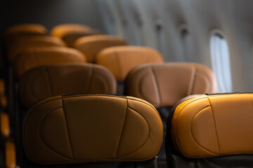 Fototapeta premium Background and banner : Empty passenger seats. empty comfortable business class seats. Inside modern private jet airplane