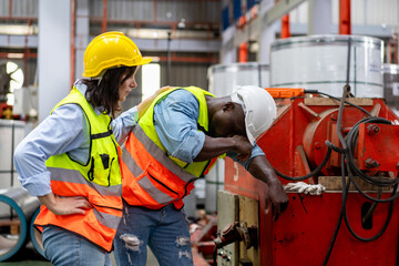 tired male worker feeling sick after stressed work in manufacturing factory, exhausted man...