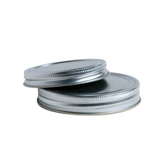 Two metal lids stacked, highlighting their shiny, reflective surface against a white background, perfect for canning or storing food, emphasizing simplicity and functionality.