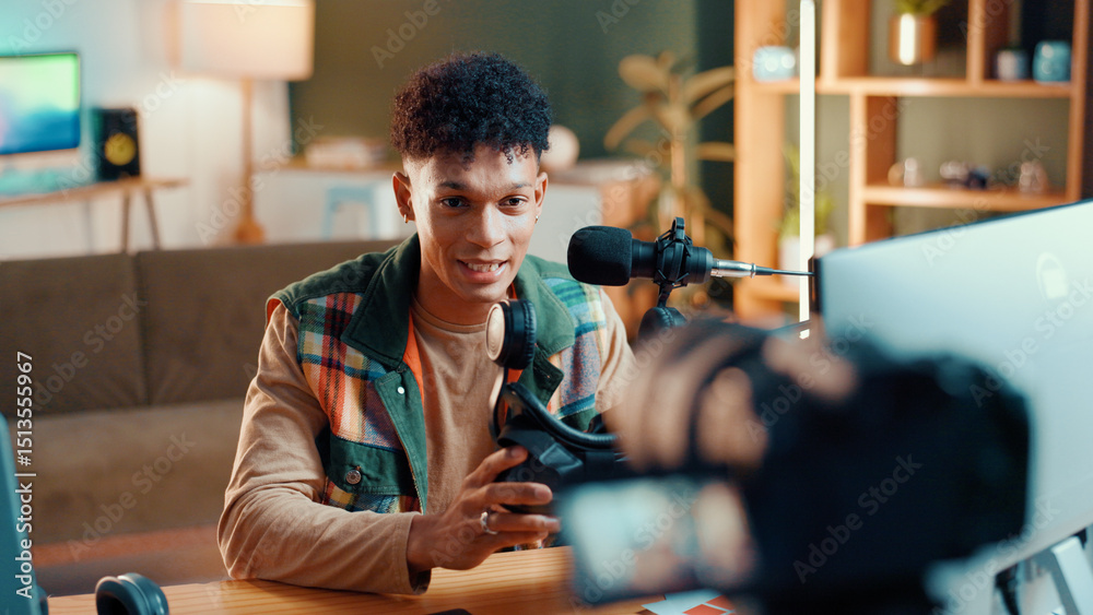 Poster man, influencer and online streaming with video camera for gaming tips, tutorial or live recording. 