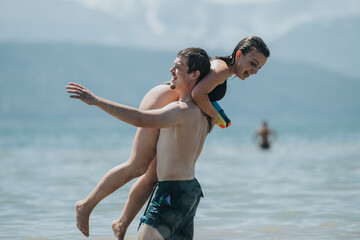Joyful friends on a summer day having fun near the water at the lake.
