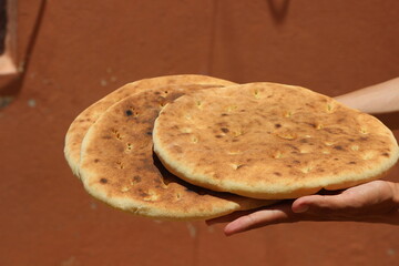 Hands holding traditional moroccan bread