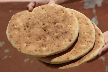 Hands holding traditional moroccan bread