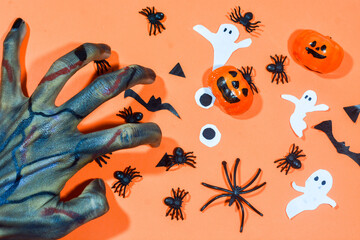 Background with a Halloween theme, with scary ghost finger objects, lollipops and scary pumkins. October is the month of ghosts