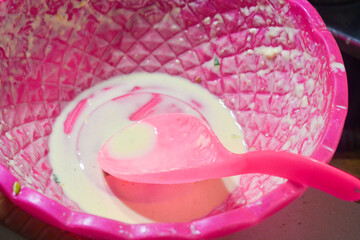 A cooking container made of plastic, suitable for washing cooking ingredients.
