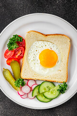 Fried gashouse eggs in bread egg in the basket delicious snack breakfast in a bowl fresh delicious gourmet food background on the table rustic food top view copy space