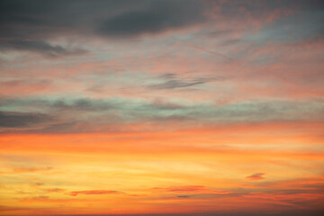 Sky,Beautiful sunset view, luxury soft gradient orange gold clouds and sunlight on the blue dramatic sky perfect for the background, morning, evening,Twilight, climate change,horizontal sunset photo