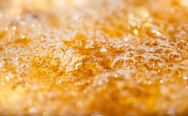 Close up bright orange Oil or beer splash texture and nature waves, Beautiful waves curve and...