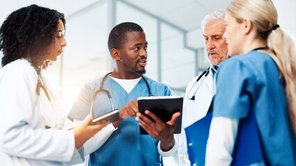 Fototapeta premium Medical, planning or tablet with doctors and nurses in hospital together for discussion or report. Feedback, healthcare and insurance with professional medicine team in clinic for diagnosis review
