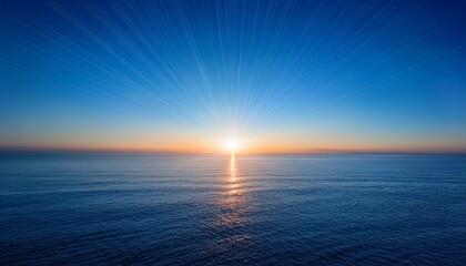 sunrise at the center of clear blue sky ocean