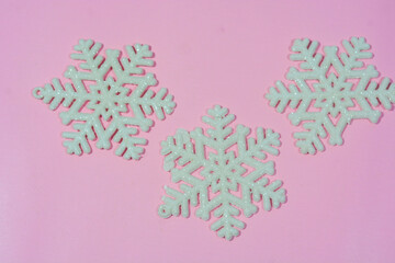 Elegant Christmas background with pink and gold decorations, including baubles, stars, and wrapped gifts. Perfect for festive holiday themes, greeting cards, and seasonal promotions