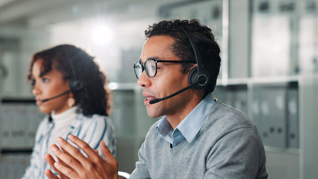 Consulting, contact us and support with man in call center for assistance, feedback or online help. Coworking, explain and headset with virtual assistant at desk in office for customer service - Powered by Adobe