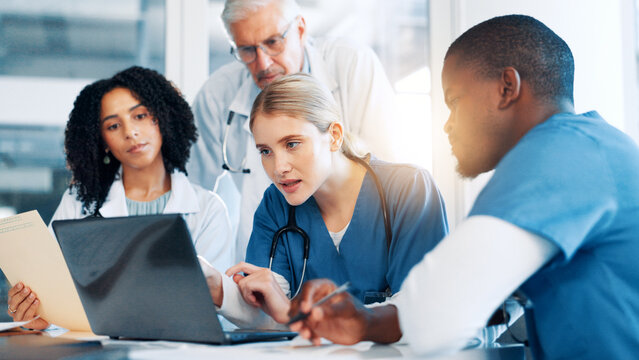 Laptop, discussion and team of doctors in hospital boardroom with medical report for treatment planning. Computer, research and group of healthcare workers with manager for surgery schedule in clinic