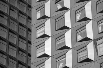 Contrasting Modern and Contemporary Building Facades with Geometric Window Designs, black and white